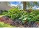 Beautiful landscaping with vibrant plants and flowers adds charm to the home's exterior at 1422 Iroquois St, North Charleston, SC 29405