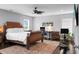 Comfortable primary bedroom with a ceiling fan, desk, and plenty of natural light at 1422 Iroquois St, North Charleston, SC 29405