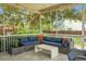 Comfortable screened porch with outdoor furniture and string lights, perfect for relaxation and entertaining at 1422 Iroquois St, North Charleston, SC 29405