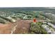Scenic aerial shot captures community homes near lush trees and marsh at 160 Palm Cove Way, Mount Pleasant, SC 29466
