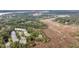 Scenic aerial view of waterfront homes surrounded by lush greenery at 160 Palm Cove Way, Mount Pleasant, SC 29466