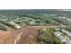 Aerial view of beautiful homes surrounded by scenic waterways and trees at 160 Palm Cove Way, Mount Pleasant, SC 29466