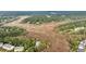 Expansive aerial view showcasing marshland surrounding homes nestled among lush greenery at 160 Palm Cove Way, Mount Pleasant, SC 29466