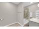 Neutral bathroom with a tub-shower combination, a sliding glass door, and a vanity with lots of storage at 160 Palm Cove Way, Mount Pleasant, SC 29466