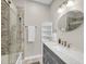 Modern bathroom showcasing a corner glass shower, granite countertops, and neutral tile work at 160 Palm Cove Way, Mount Pleasant, SC 29466
