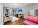 Versatile bonus room with hardwood floors, a daybed, a ballet barre, and a large screen television at 160 Palm Cove Way, Mount Pleasant, SC 29466