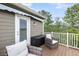 Cozy outdoor deck space with comfortable seating, complemented by a storage box for convenience at 160 Palm Cove Way, Mount Pleasant, SC 29466