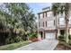 Charming townhome exterior with manicured landscaping and private driveway entrance to the garage at 160 Palm Cove Way, Mount Pleasant, SC 29466