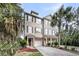 Beautiful townhome with shutters, a driveway, a garage, and trees in the front yard at 160 Palm Cove Way, Mount Pleasant, SC 29466