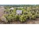 Secluded two-story home surrounded by lush greenery, offering privacy and serene views at 160 Palm Cove Way, Mount Pleasant, SC 29466