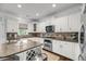 Charming kitchen with stainless steel appliances, granite countertops, and white cabinets at 160 Palm Cove Way, Mount Pleasant, SC 29466