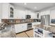 Gourmet kitchen with stainless steel appliances, granite countertops and white cabinets at 160 Palm Cove Way, Mount Pleasant, SC 29466