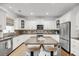 Bright kitchen with granite counters, stainless steel appliances, and a large center island with barstool seating at 160 Palm Cove Way, Mount Pleasant, SC 29466