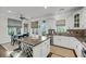 Eat-in kitchen features granite countertops, white cabinets and a center island at 160 Palm Cove Way, Mount Pleasant, SC 29466