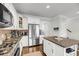 Modern kitchen featuring stainless steel appliances, granite countertops, and white cabinets at 160 Palm Cove Way, Mount Pleasant, SC 29466