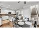 Open kitchen with an island, stainless steel appliances, and hardwood floors at 160 Palm Cove Way, Mount Pleasant, SC 29466