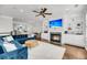 Living room with a fireplace, built in cabinets, and large flat screen television at 160 Palm Cove Way, Mount Pleasant, SC 29466