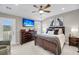 Tranquil main bedroom with a large bed, stylish furnishings, and balcony access with natural light at 160 Palm Cove Way, Mount Pleasant, SC 29466