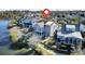 Waterfront home featuring a fenced yard, a metal roof, and picturesque views of the surrounding landscape at 1615 Paradise Lake Dr, Mount Pleasant, SC 29464