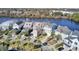 Aerial view of waterfront houses, beautiful landscaping, and the waterway adjacent to the community at 1615 Paradise Lake Dr, Mount Pleasant, SC 29464