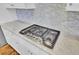 Close up of cooktop in the kitchen with tile backsplash at 1615 Paradise Lake Dr, Mount Pleasant, SC 29464