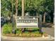 Community entrance sign with lush landscaping and mature trees at 1615 Paradise Lake Dr, Mount Pleasant, SC 29464