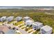 Aerial view of a neighborhood with multi-story homes, green lawns, and beautiful marsh views at 1714 Fort Palmetto Cir, Mount Pleasant, SC 29466