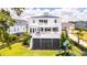 Expansive backyard featuring a playset, lush lawn, and a two-story home with a charming porch at 1714 Fort Palmetto Cir, Mount Pleasant, SC 29466