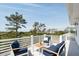 Relax on this serene balcony with stylish outdoor furniture and picturesque views at 1714 Fort Palmetto Cir, Mount Pleasant, SC 29466