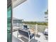 Enjoy outdoor living on this covered balcony with comfortable seating and scenic views at 1714 Fort Palmetto Cir, Mount Pleasant, SC 29466