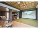 Finished basement with golf simulator, projector, built-in bar and entertainment space at 1714 Fort Palmetto Cir, Mount Pleasant, SC 29466