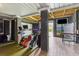Finished basement with golf simulator, bar-top seating and open access to rest of basement at 1714 Fort Palmetto Cir, Mount Pleasant, SC 29466