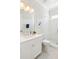 This white bathroom is decorated with stylish leaf pattern wallpaper and features a walk in shower at 1714 Fort Palmetto Cir, Mount Pleasant, SC 29466
