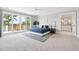 Sun-filled bedroom features balcony access and a modern en-suite bathroom at 1714 Fort Palmetto Cir, Mount Pleasant, SC 29466