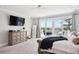 Bright bedroom boasts a sliding glass door to a private balcony with scenic views at 1714 Fort Palmetto Cir, Mount Pleasant, SC 29466