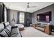 This game room features carpet, a home theater, and guitars hanging on the wall at 1714 Fort Palmetto Cir, Mount Pleasant, SC 29466