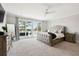 Spacious bedroom features plush carpeting, a tufted headboard, and access to a private balcony at 1714 Fort Palmetto Cir, Mount Pleasant, SC 29466
