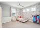 Comfortable bedroom featuring a ceiling fan, floral-themed wall and natural light at 1714 Fort Palmetto Cir, Mount Pleasant, SC 29466