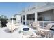 Outdoor deck area featuring comfortable seating around a cozy fire pit and space for grilling at 1714 Fort Palmetto Cir, Mount Pleasant, SC 29466