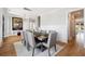 Bright dining room featuring a lovely painting, light fixture, and table set for the holidays at 1714 Fort Palmetto Cir, Mount Pleasant, SC 29466