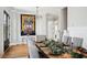 Dining room with holiday decor and a large table, featuring a unique painting on the wall at 1714 Fort Palmetto Cir, Mount Pleasant, SC 29466
