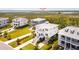 Aerial view of a two-story home with a porch, landscaping, and nearby beach access at 1714 Fort Palmetto Cir, Mount Pleasant, SC 29466