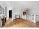 Bright upstairs hallway with wood floors, stylish mirror, and staircase at 1714 Fort Palmetto Cir, Mount Pleasant, SC 29466