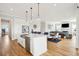 Bright, open-concept floorplan with a view of the kitchen's island and stainless steel appliances at 1714 Fort Palmetto Cir, Mount Pleasant, SC 29466