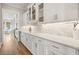 Modern kitchen featuring custom white cabinets, marble backsplash and countertop space at 1714 Fort Palmetto Cir, Mount Pleasant, SC 29466