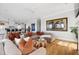 Spacious living room with hardwood floors, modern decor, and open kitchen view at 1714 Fort Palmetto Cir, Mount Pleasant, SC 29466