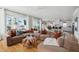 Open-concept living area with a sectional sofa and lots of windows with natural light at 1714 Fort Palmetto Cir, Mount Pleasant, SC 29466