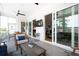Comfortable screened in porch with open access to interior and ample seating for entertaining at 1714 Fort Palmetto Cir, Mount Pleasant, SC 29466