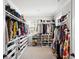Large walk-in closet provides ample space for storage with custom shelving and hanging racks at 1714 Fort Palmetto Cir, Mount Pleasant, SC 29466