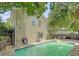 Charming backyard with a refreshing swimming pool, lush greenery, and a patio area, great for Gathering gatherings at 1743 Orange Grove Shores Dr, Charleston, SC 29407